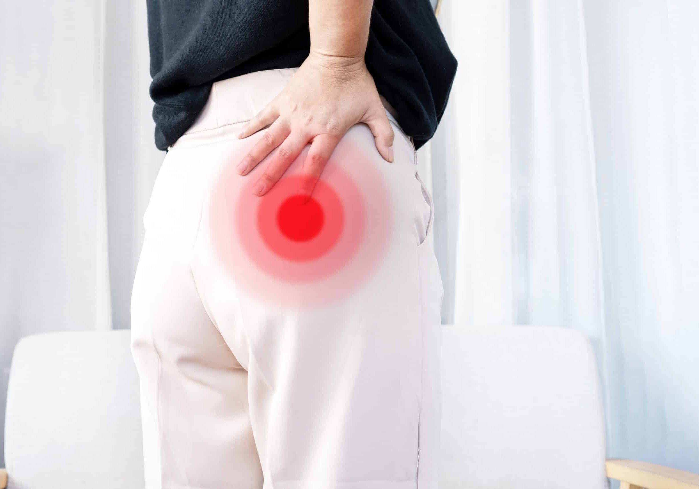 Piriformis syndrome concept with woman suffering from buttock muscle pain when sitting